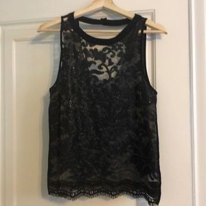 ASTR sleeveless, black top.